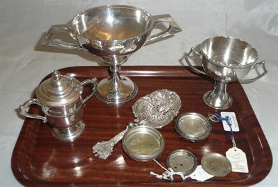 Lot 496 - Three silver two handled small cups, a sifter spoon and four part watch cases, 18oz