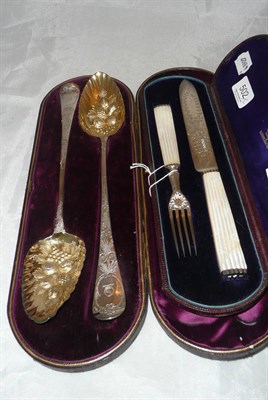 Lot 502 - Cased pair of berry spoons and cased mother-of-pearl and silver cake knife and fork, Sheffield 1880