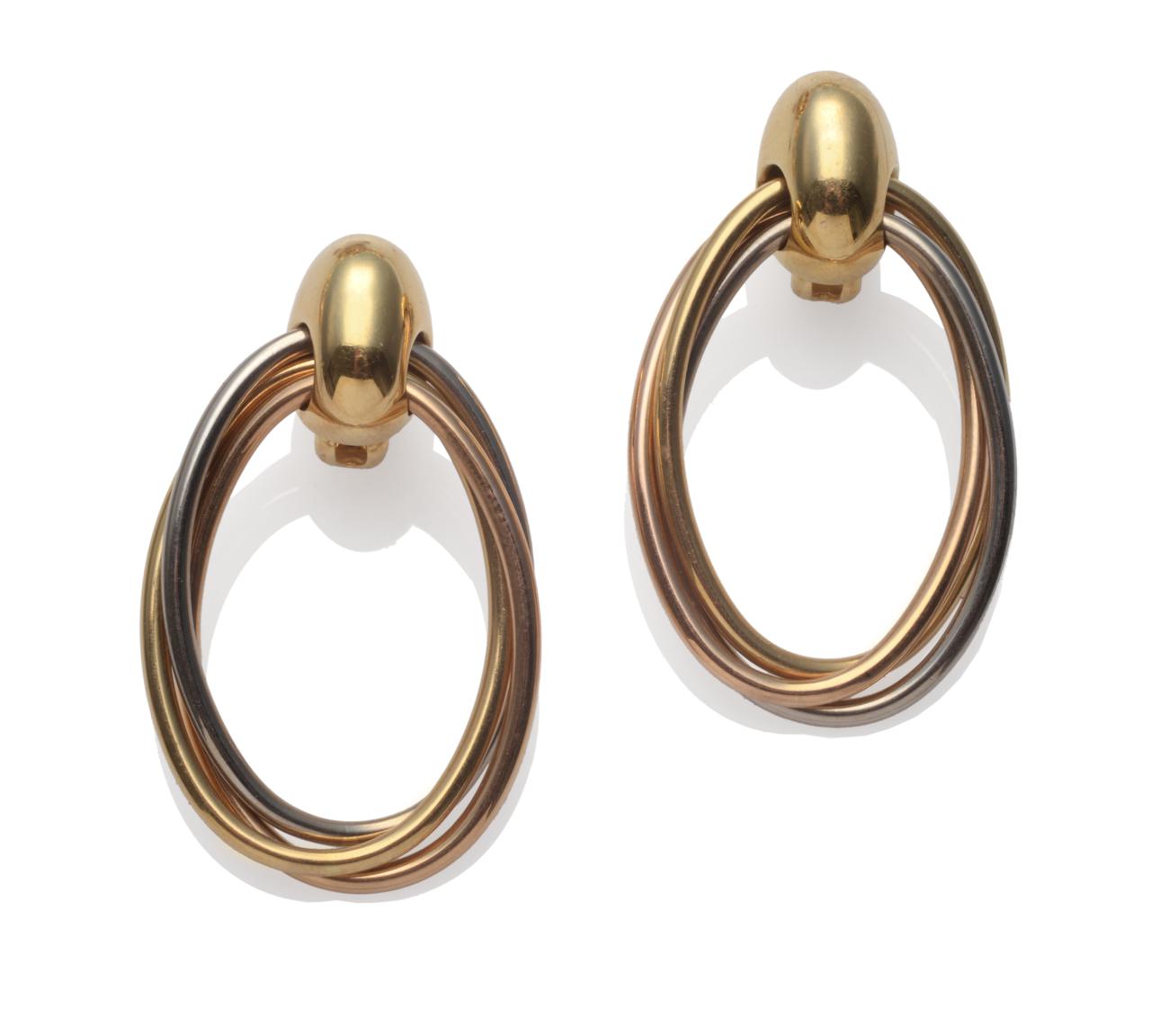Lot 246 - A Pair of Drop Earrings, by Cartier, a yellow bead suspends three entwined loops, one white,...