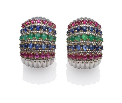 Lot 250 - A Pair of Ruby, Sapphire and Emerald Ear Clips, by Sabbadini, rows of cabochon gemstones in...