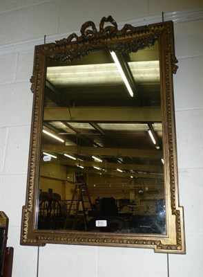 Lot 610 - A gilt framed wall mirror with ribbon bow pediment