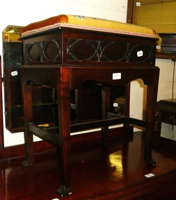 Lot 614 - Mahogany piano stool with lever work hinged box seat