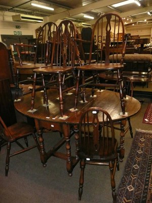 Lot 615 - A Titchmarsh and Goodwin oak gateleg table and eight chairs