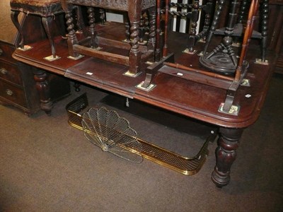 Lot 620 - A Victorian wind action dining table on heavy melon fluted turned tapering supports, fitted...