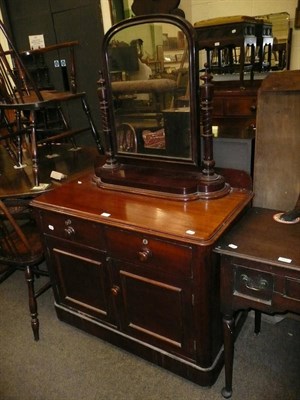 Lot 624 - A Victorian mahogany washstand with two frieze drawers and panelled cupboards below on platform...