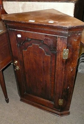 Lot 627 - An 18th century oak hanging corner cupboard