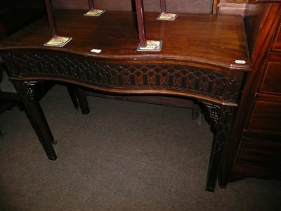 Lot 635 - A serpentine side table