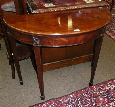 Lot 641 - Mahogany demi-lune fold over tea table