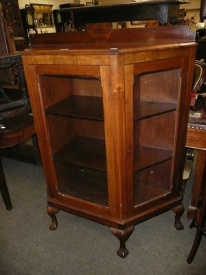 Lot 643 - A walnut three door display cabinet