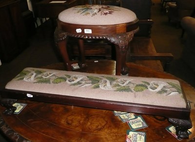 Lot 660 - A narrow stool with ball and claw feet, and another stool, both with needlework tops