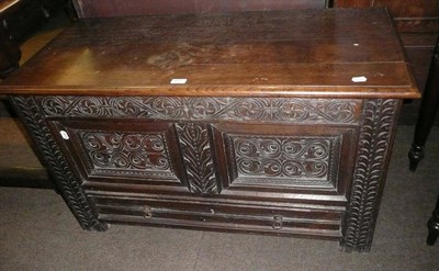 Lot 663 - A 17th century oak coffer with double panelled front fitted with later drawer below, 110cm wide