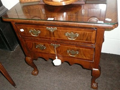 Lot 665 - An 18th century walnut two height chest of drawers, later converted from a commode