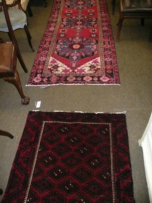 Lot 682 - Balouch red ground rug and a runner