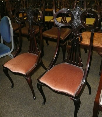 Lot 685 - A pair of carved mahogany side chairs