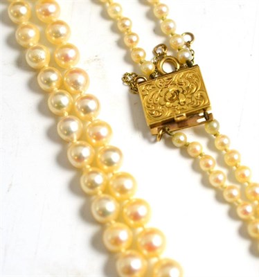Lot 263 - A Cultured Pearl Necklace, the graduated pearls knotted to an engraved oblong clasp, length 48.5cm