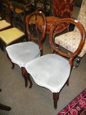 Lot 688 - A pair of Victorian rosewood balloon back salon chairs