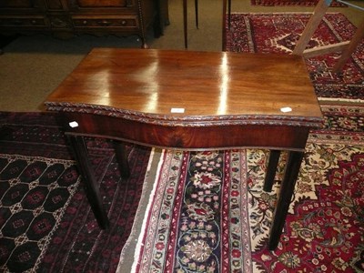 Lot 696 - A Georgian style mahogany fold over tea table