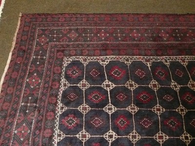 Lot 699 - A Balouch carpet with compartmentalised design