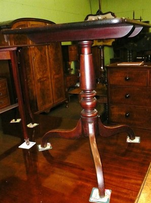 Lot 704 - A 19th century mahogany tilt top tripod table