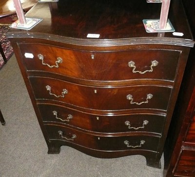 Lot 710 - A reproduction mahogany serpentine four height chest