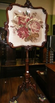 Lot 720 - A Victorian rosewood pole screen with needle work banner