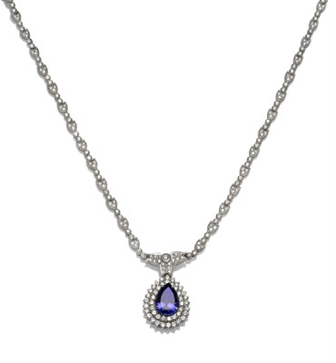 Lot 267 - A Tanzanite and Diamond Necklace, a pear cut tanzanite within a double border of round...
