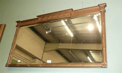 Lot 740 - A gilt framed overmantel mirror with horizontal mirror plate in a neo-classical frame