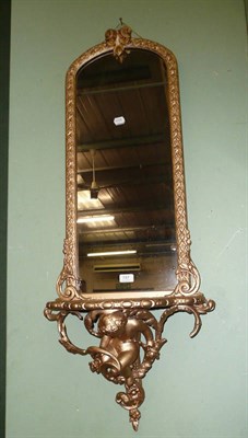 Lot 747 - A gilt framed pier glass with shaped bracket