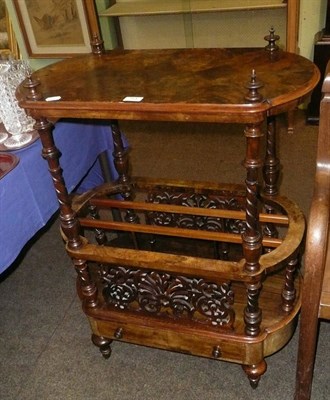 Lot 754 - A Victorian figured walnut Canterbury with table top