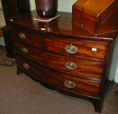 Lot 759 - An early 19th Century mahogany bow front three height chest