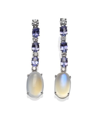 Lot 271 - A Pair of 18 Carat White Gold Diamond, Tanzanite and Moonstone Drop Earrings, round brilliant...