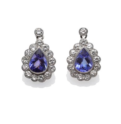 Lot 272 - A Pair of Tanzanite and Diamond Earrings, a pear cut tanzanite within a border of round...
