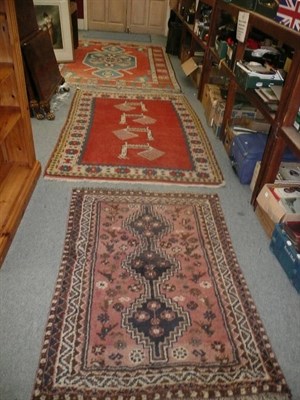 Lot 799 - Two belouch rugs and two red ground rugs (4)