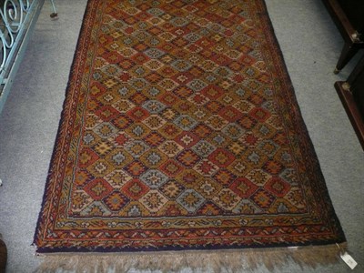 Lot 838 - A machine woven Persian style runner