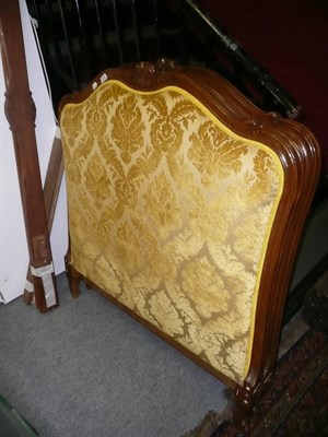 Lot 839 - A pair of French oak headboards with yellow upholstery