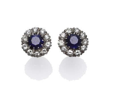 Lot 280 - A Pair of Sapphire and Diamond Cluster Earrings, the round mixed cut sapphires within a border...
