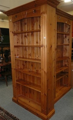 Lot 867 - A pair of tall pine open bookcases