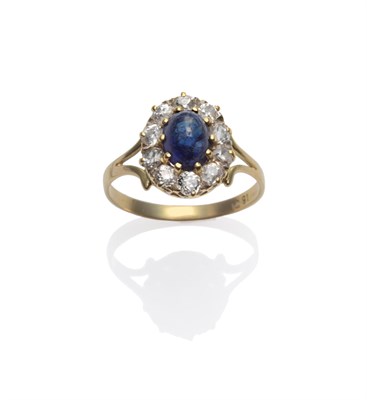 Lot 282 - A Sapphire and Diamond Cluster Ring, the oval cabochon sapphire within a border of old cut diamonds