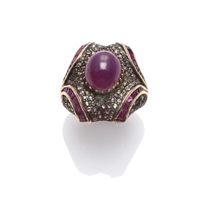 Lot 283 - An Indian Ruby and Diamond Ring, a cabochon ruby within a chunky frame set with rose cut...