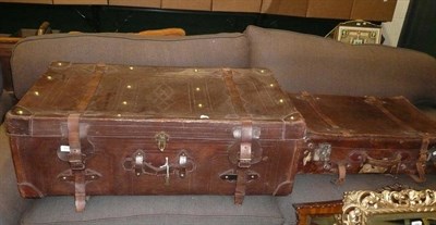 Lot 895 - Two leather and brass travelling trunks