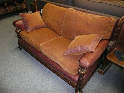 Lot 899 - A leather and chenille upholstered settee