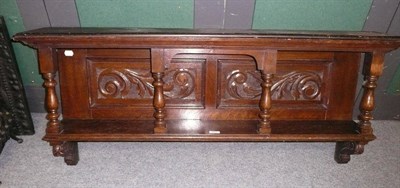 Lot 901 - A carved oak over mantel shelf