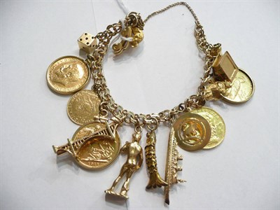 Lot 93 - A fancy curb bracelet hung with charms including two full sovereigns, three other coins and others