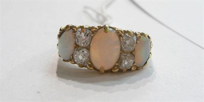Lot 103 - An opal and diamond ring