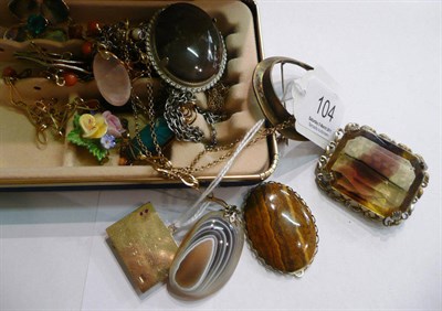 Lot 104 - A small jewellery box containing a pendant 'Health, Wealth, Luck, Love' and assorted jewellery...