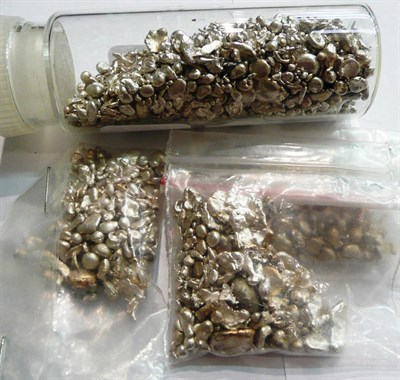 Lot 115 - Assorted white metallic nuggets in a jar and in bags