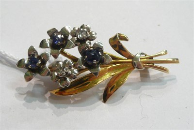 Lot 125 - A 9ct gold diamond and sapphire brooch