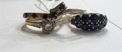 Lot 127 - Sapphire cluster ring, solitaire ring, sapphire and diamond half eternity ring and three stone ring