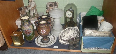 Lot 132 - Two pottery groups, clocks, ceramics and pieces of lace and linen (shelf)