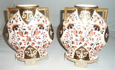 Lot 153 - A pair of pottery 'Old Hall' moon vases